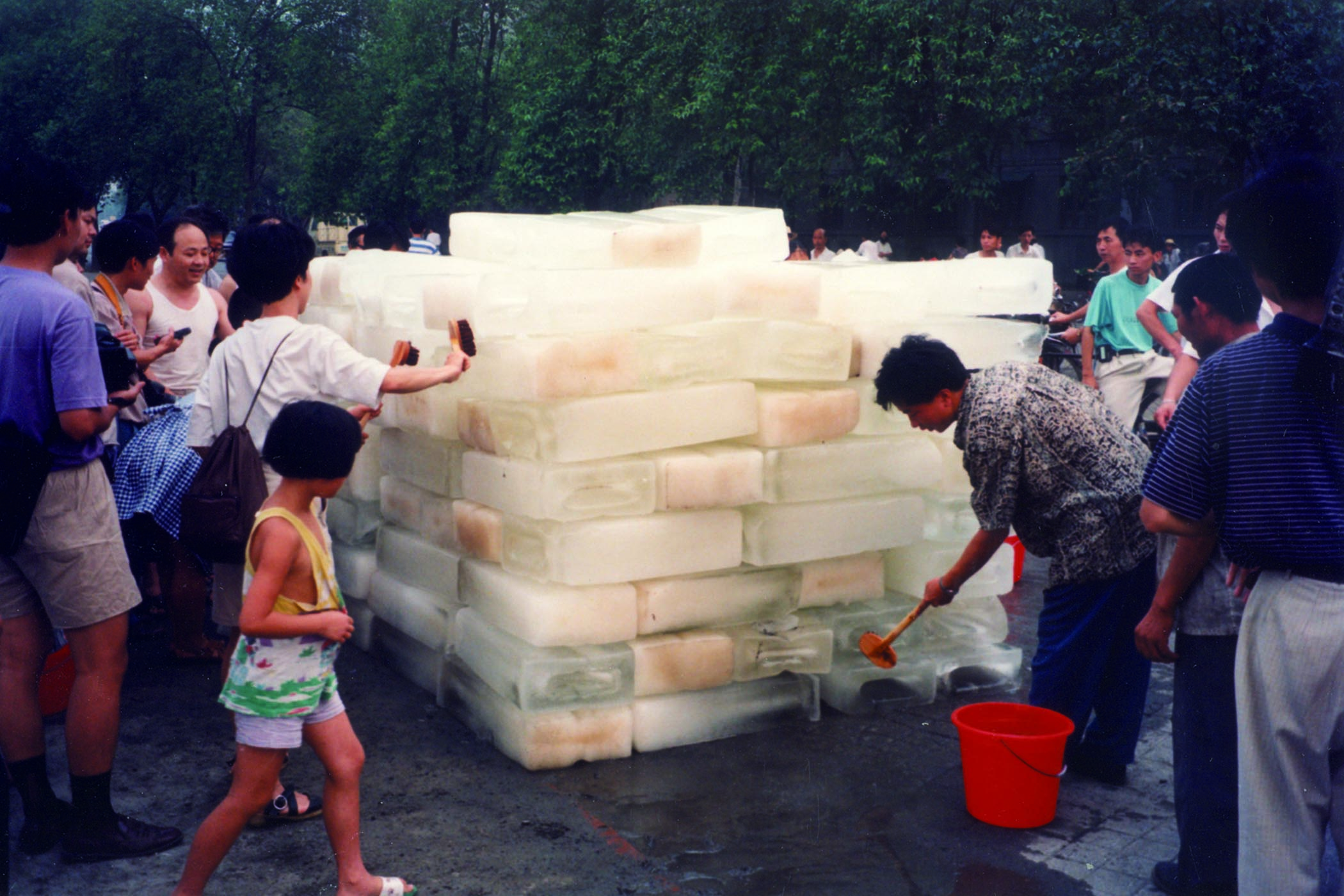 A still from Xiu﻿zhen’s ‘moving video’ Washing River, 1995. Main image: visitors can enter her structure clothed with pink garments