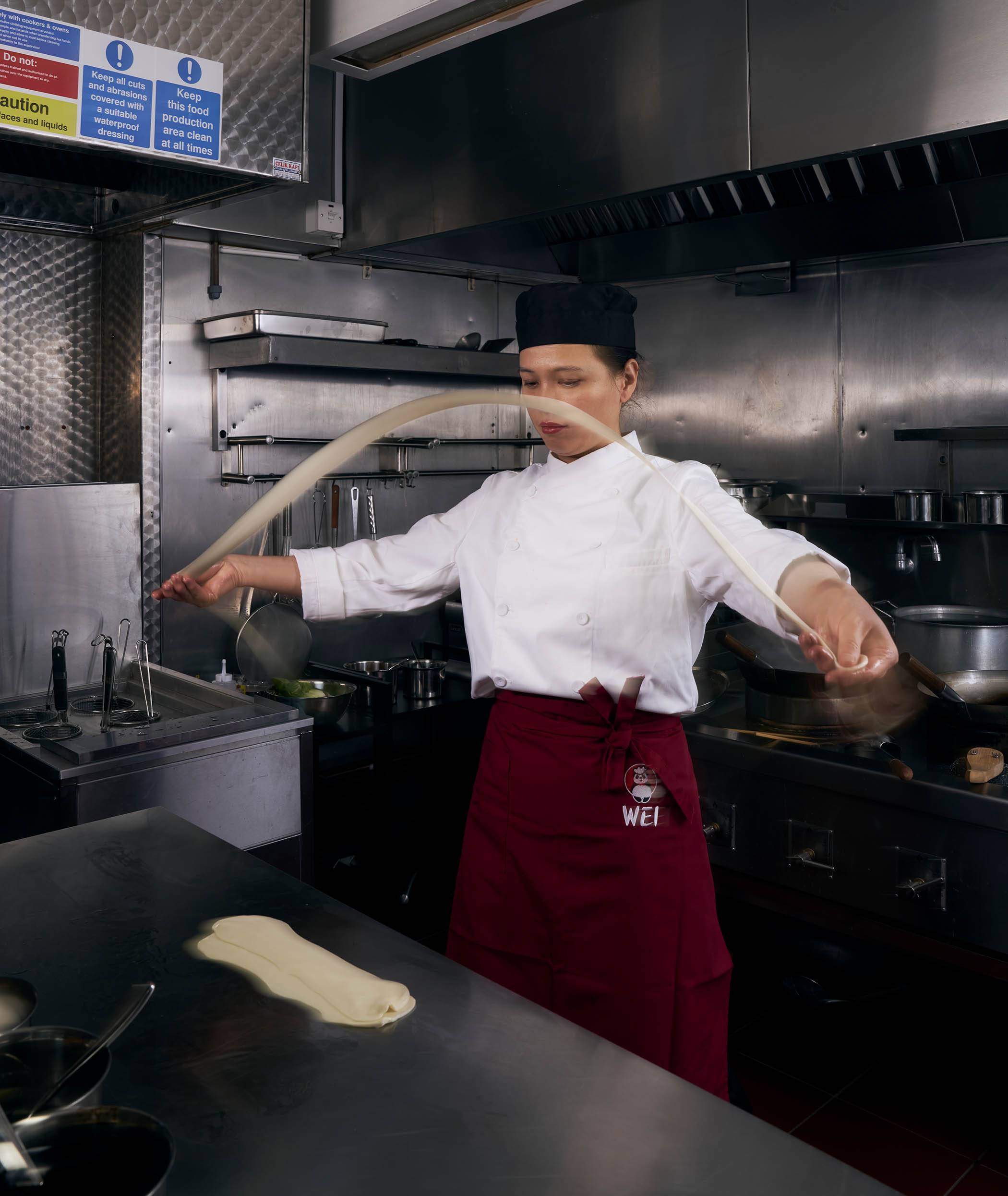 Guirong Wei, chef-founder of Master Wei / Dream Xi’an, with biang biang noodles. Above all other noodle dishes, she loves a family recipe. ‘My favourite dish is a braised noodle stew with cured pork that my grandmother makes. The cured pork is smoked using cypress branches, a traditional method passed down in our family for generations. She also adds mung beans from the hills to the stew. The noodles are cooked in the broth from simmering the cured pork and the mung beans, then knife-shaved noodle sheets are added to the stew.’