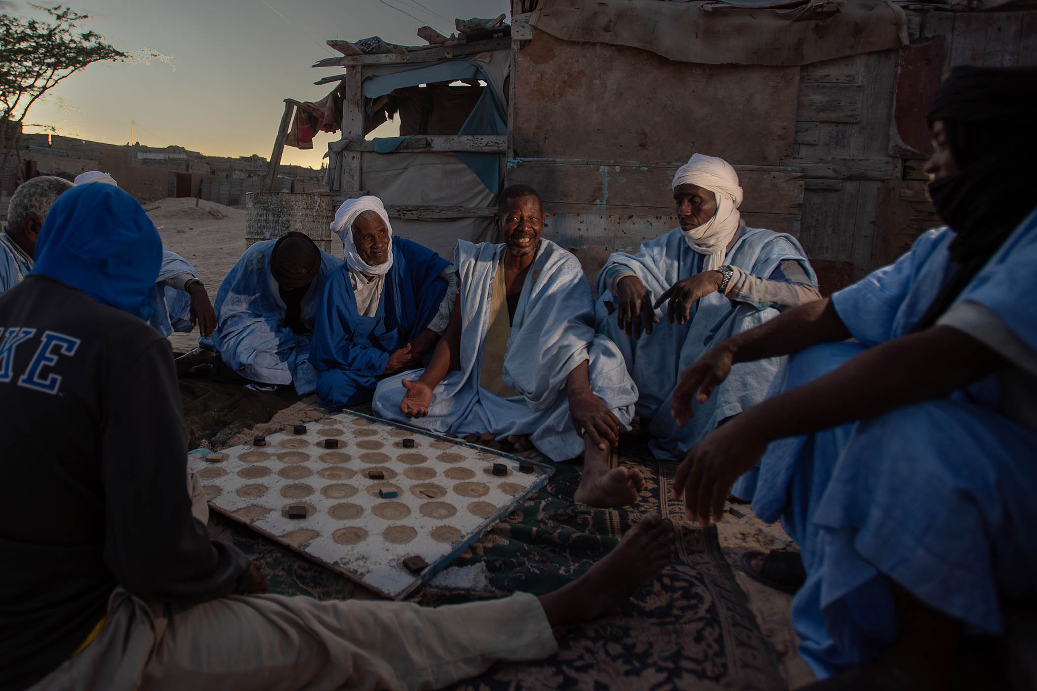 Men in Nouadhibou playing draughts – it can be a long waiting game for migrants