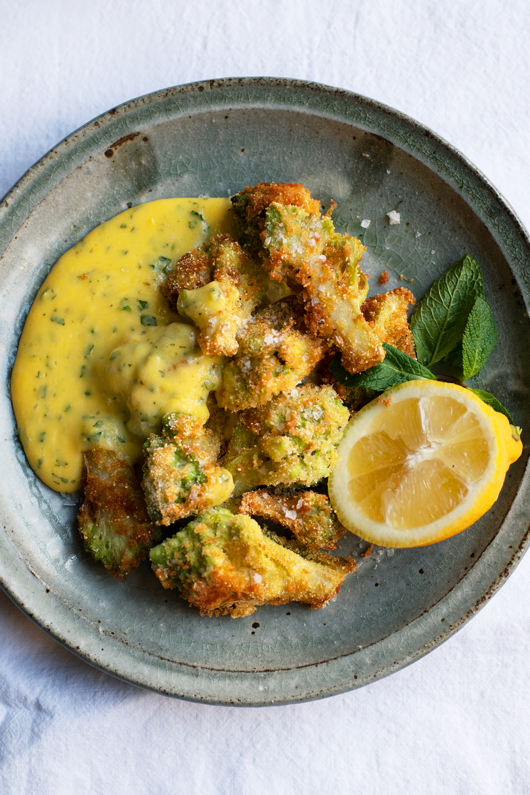 Messy task: Dip cauliflower in polenta for a crisp sauce pairing