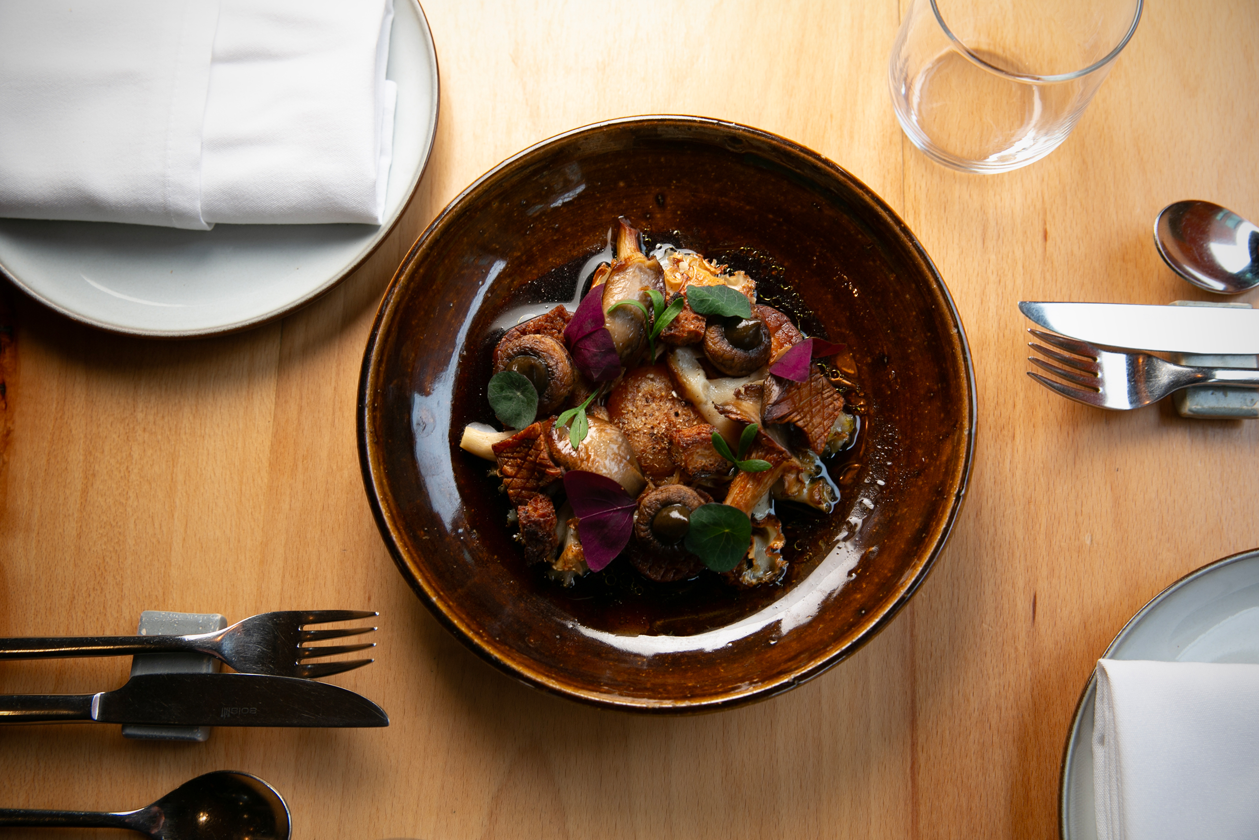 ‘Perfect mouthful’: mushroom, miso-cured yolk, pickled enoki, roast onion tea.