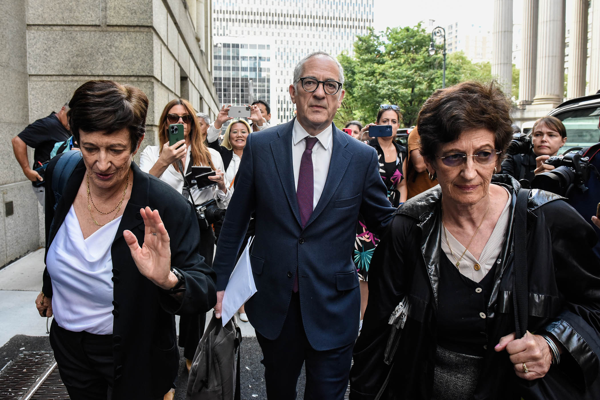 Isabel, Kevin and Christine Maxwell outside a New York court after Ghislaine was sentenced to 20 years for child sex trafficking in 2022