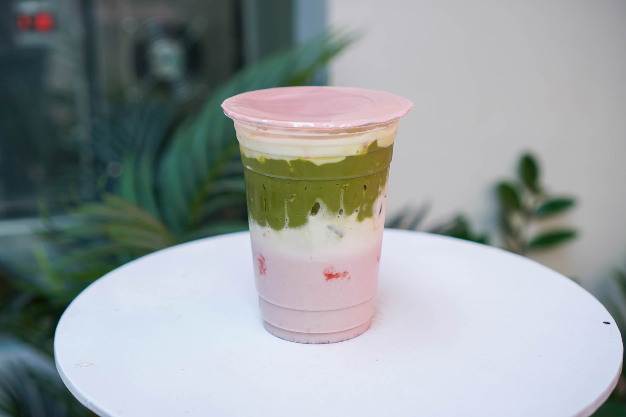 Pink top: a cup of strawberry milk topped with matcha green tea cream