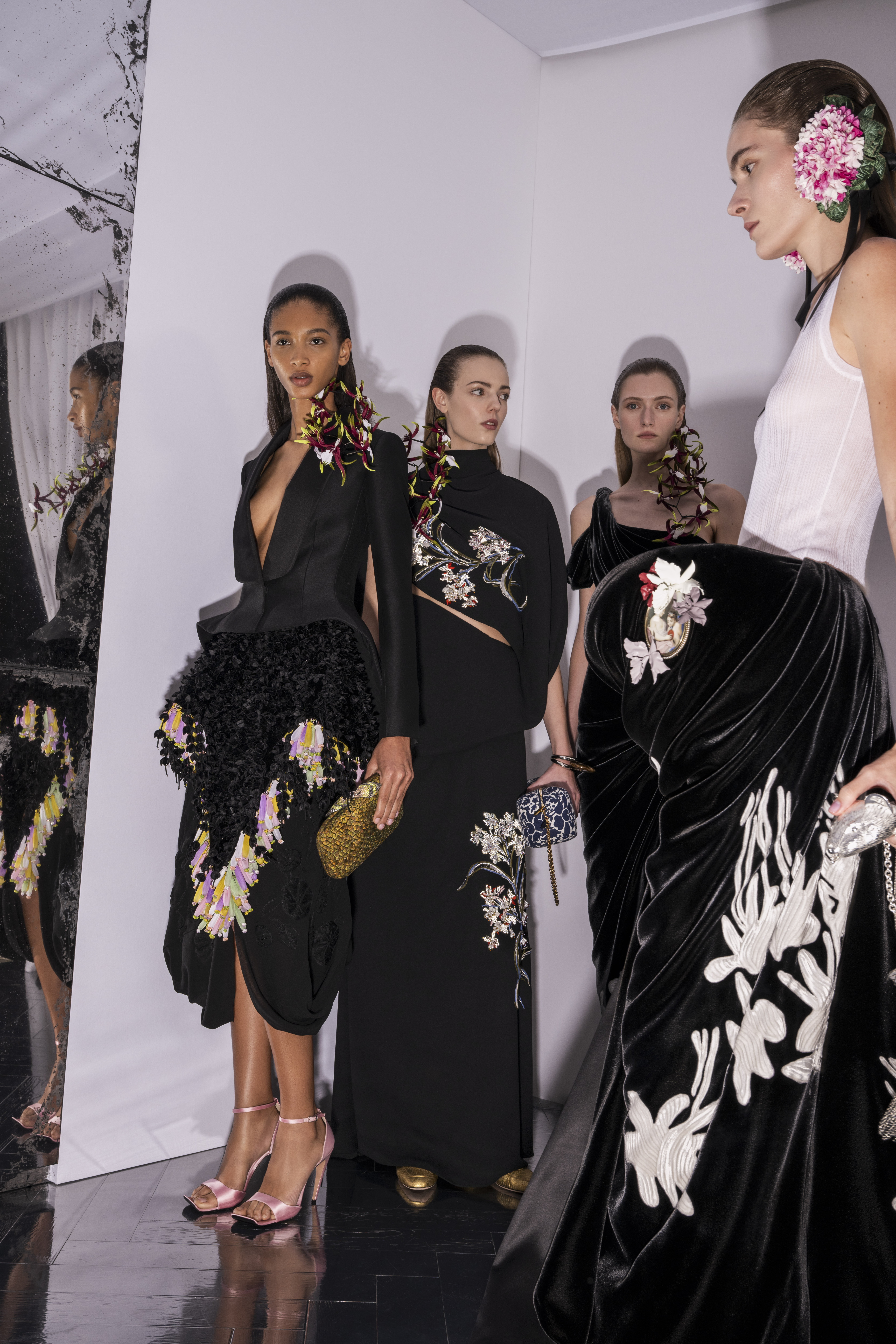 ORCHIDÉE Asymmetrical long dress in double georgette, extended with a scarf panel wrapping the body, blue and silver wild flower embroideries accented with fresh water pearls and faceted beads bias rouleaux stems, rhinestone chains, rhodoid elements and chenille. PANTOMIME Tank top in white silk, sculpted black velvet skirt with abstract white floral motifs taken from a screen print by Magdalene Odundo, asymmetrically draped and held by a boned construction at the hip. ANGUILLE Bar jacket in black wool with satin lapels, velevet peplum embroidered with a cascade of black velvet wisteria, a vegetal cluster of multicoloured shibori organza. Georgette silk embroidered with nasturtiums in threads and shirred black silk chiffon